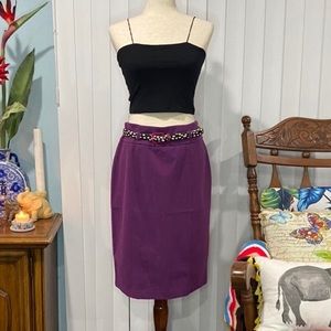 purple pencil skirt with back zipper, belt loops, and two back slits